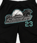 Black and navy Trapstar Shooters SS23 Basketball shorts featuring signature Shooters branding, an elastic waistband, side pockets, and a relaxed athletic fit.